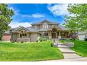 Beautiful home with well-manicured lawn and landscaping, showcasing curb appeal at 2252 S Queen St, Lakewood, CO 80227