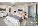 Bright bedroom with a queen bed and walk-in closet at 9709 Covey Ct # 9709, Denver, CO 80260