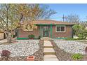 Charming brick home with a rock front yard and a welcoming, covered entryway at 8511 Essex Dr, Denver, CO 80229
