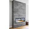 Modern fireplace with full wall of elegant gray tile, and a sleek, linear firebox at 1543 Glencoe St, Denver, CO 80220