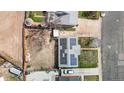Overhead drone shot of home's roof with solar panels, along with the backyard and a detached garage at 3341 W 94Th Ave, Westminster, CO 80031