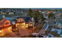 Aerial view of a teal home with solar panels, situated in a residential neighborhood at 13363 Cherry Ct, Thornton, CO 80241