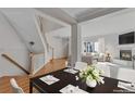 Elegant dining area adjacent to the living room with natural light and stylish decor at 2660 S University Blvd # I, Denver, CO 80210