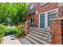 Charming brick townhome with a welcoming front entrance and manicured landscaping at 2660 S University Blvd # I, Denver, CO 80210