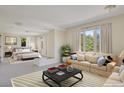 Spacious open-concept featuring a relaxing living area with views of the large main bedroom at 2660 S University Blvd # I, Denver, CO 80210