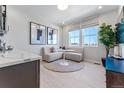 Bright breakfast nook with a corner sofa, round table and large window offering lots of natural light at 3456 Recess Ln, Castle Rock, CO 80108