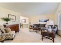 Cozy living room with neutral walls, plush seating, and stylish decor creating a relaxing atmosphere at 7926 S Corona Ct, Centennial, CO 80122