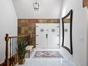 Elegant foyer featuring marble floors, a patterned rug, double front doors, and natural light at 5884 S Hanover Way, Greenwood Village, CO 80111