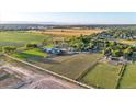 Aerial view of a spacious property with farmlands, and residential areas at 10876 Maple Rd, Lafayette, CO 80026