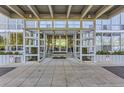Building entrance with gray metal and glass facade, welcoming visitors into a modern residence at 3100 E Cherry Creek South Dr # 1101, Denver, CO 80209