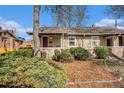 Charming single story home with mature landscaping and covered front porch at 3726 Decatur St, Denver, CO 80211