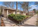 Charming bungalow-style home with manicured landscaping and inviting front porch at 3726 Decatur St, Denver, CO 80211