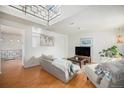 Bright living room featuring skylight, hardwood floors and modern decor at 3726 Decatur St, Denver, CO 80211