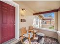 Inviting front porch with seating area and a bright, welcoming entrance at 3726 Decatur St, Denver, CO 80211
