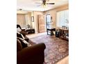 Cozy living room featuring hardwood floors, neutral walls, and stylish furniture at 1516 S Lowell Blvd, Denver, CO 80219