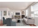 Inviting living room with neutral walls, fireplace, area rug and bright natural light at 10266 Stagecoach Ave, Firestone, CO 80504