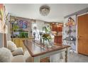 Inviting dining room with chandelier lighting and open access to the kitchen at 3023 S Fenton St, Denver, CO 80227