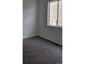 Simple bedroom with carpet, one window, and neutral walls at 498 Grey Rock St, Brighton, CO 80601