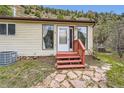 Front entryway with a painted porch with flagstone walkway at 4 Virginia St, Idaho Springs, CO 80452