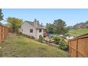 A fenced backyard with a patio that has views of the water at 12668 W 1St Pl # 81, Denver, CO 80228