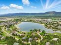 Panoramic aerial view of the community showcasing the beautiful lake and mountain views at 18590 Lower Lake Rd, Monument, CO 80132