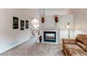 Bright living room with fireplace and neutral tones, perfect for relaxation at 10652 Hyacinth St, Highlands Ranch, CO 80129