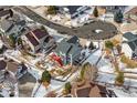 Aerial view showcasing the house's backyard, landscaping, and neighborhood context at 1820 Cooper Ct, Castle Rock, CO 80109