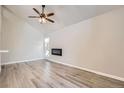 Bright living room with wood floors, high ceilings, and a modern fireplace at 3539 S Fairplay Way # 10, Aurora, CO 80014