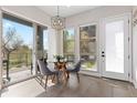 Bright breakfast nook featuring modern lighting, table with seating, and natural light at 5026 S Platte River Pkwy, Littleton, CO 80123