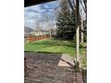 Large, verdant back yard is great for and pets; surrounded by mature trees and wood fence at 6454 S Nelson Way, Littleton, CO 80127