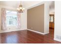 Elegant dining room with hardwood floors and natural light, perfect for Gathering gatherings at 16873 Boreas Ct, Parker, CO 80134