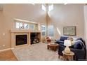 This expansive living room boasts a fireplace, large windows, and comfortable seating at 10505 Wheeling St, Commerce City, CO 80022