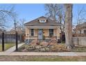 Charming single-story home featuring a quaint front porch and rock landscaping at 3907 S Lincoln St, Englewood, CO 80113