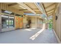 Covered front patio with double doors, a skylight, and beautiful stone accents at 5073 N Lariat Dr, Castle Rock, CO 80108
