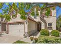 Charming home featuring stone accents, a two-car garage, and beautifully landscaped front yard at 4194 Beautiful Cir, Castle Rock, CO 80109