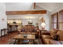 Spacious living room with open floorplan with hardwood floors and comfortable leather seating at 16052 Deer Ridge Dr # B, Morrison, CO 80465