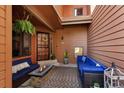 Inviting outdoor patio with comfortable seating, a fire pit, and stylish decor at 16052 Deer Ridge Dr # B, Morrison, CO 80465