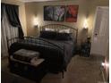 Inviting bedroom with neutral walls, decorative wall sconces, and a cozy seating area at 6711 S Ivy Way # B5, Centennial, CO 80112