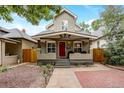 Charming home exterior with a covered porch and a welcoming red front door, perfect curb appeal at 3440 W 33Rd Ave, Denver, CO 80211