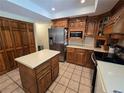 Traditional eat-in kitchen boasts stainless appliances, an island, and generous counter space at 7290 S Cook Cir, Centennial, CO 80122