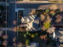 Gorgeous aerial view showcasing the home's mature landscaping and location in a lovely neighborhood at 5350 S Marshall St, Littleton, CO 80123
