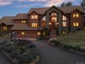 Stunning two-story home with a dramatic entryway and landscaped grounds at 28940 Pinewood Vista Dr, Evergreen, CO 80439