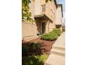 Inviting entrance with landscaped garden, showcasing charming brickwork and manicured greenery at 2314 S University Blvd, Denver, CO 80210