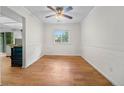 Inviting dining room with hardwood floors, wainscoting, and ample natural light from a large window at 19398 E Eastman Pl, Aurora, CO 80013