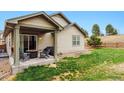 Backyard patio featuring a comfortable seating area perfect for outdoor enjoyment and relaxation at 3469 Amber Sun Cir, Castle Rock, CO 80108