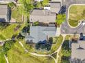 Birds eye view of gray roofed home with fenced yard neighboring a walking path at 7870 Sunflower Green # 151, Frederick, CO 80530