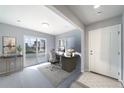 Bright home office with modern desk, comfortable chair, and plenty of natural light at 46570 Avery Ln, Bennett, CO 80102