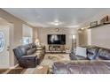 Spacious living room featuring hardwood floors and plenty of natural light at 1177 Jamaica St, Aurora, CO 80010
