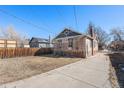 Exterior of house with a grass yard at 1453 Utica St, Denver, CO 80204