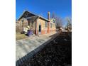 Brick house with a detached garage and a spacious backyard at 1453 Utica St, Denver, CO 80204